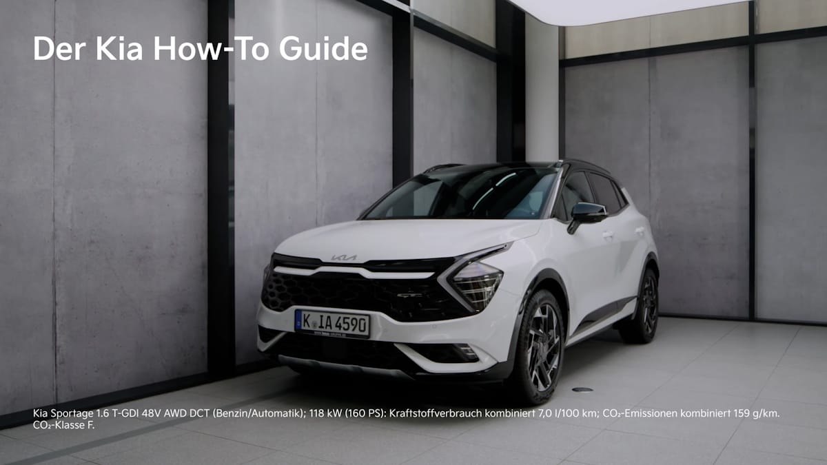 Weißer Kia Sportage, halbseitlich